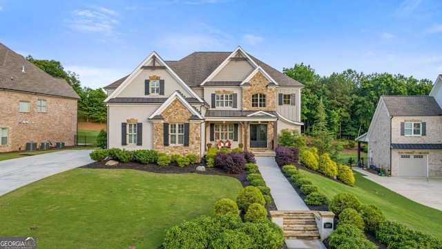 2377 Kesgrove Way, Buford, GA 30518 - craftsman inspired home with a standing seam roof, a front yard, covered porch, and stone siding