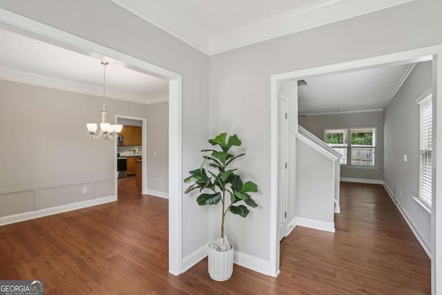4546 Water Mill Dr, Buford, GA 30519 - corridor with crown molding, dark wood-type flooring, and a chandelier