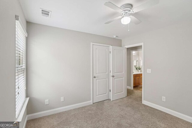 4546 Water Mill Dr, Buford, GA 30519 - unfurnished bedroom with light carpet and ceiling fan