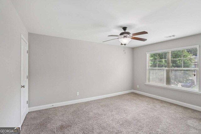 4546 Water Mill Dr, Buford, GA 30519 - spare room featuring ceiling fan and carpet