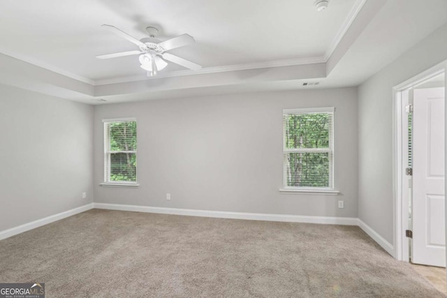 4546 Water Mill Dr, Buford, GA 30519 - carpeted spare room featuring a raised ceiling, ornamental molding, a smoke detector, and a ceiling fan