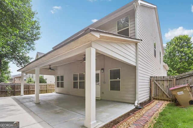 4546 Water Mill Dr, Buford, GA 30519 - rear view of house featuring a ceiling fan and a patio area