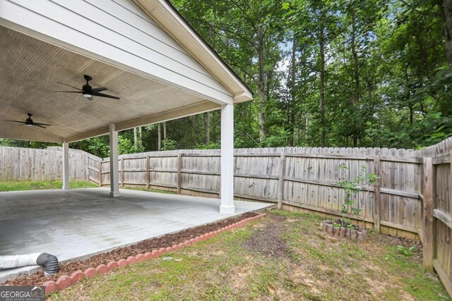 4546 Water Mill Dr, Buford, GA 30519 - fenced backyard with a ceiling fan and a patio area