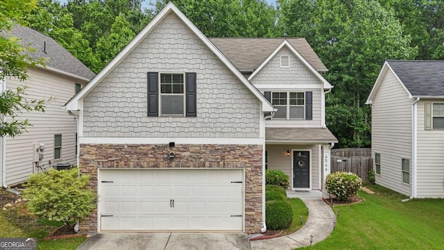 4546 Water Mill Dr, Buford, GA 30519 - craftsman-style home featuring stone siding, an attached garage, and concrete driveway