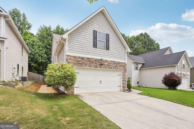 4546 Water Mill Dr, Buford, GA 30519 - view of front of property with a garage, stone siding, concrete driveway, and a front yard