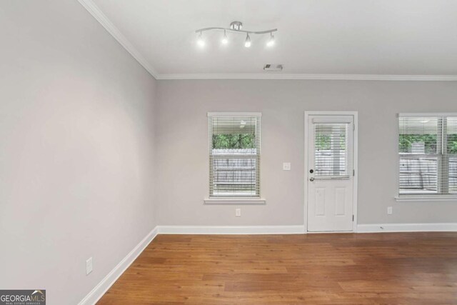 4546 Water Mill Dr, Buford, GA 30519 - empty room featuring wood finished floors and ornamental molding