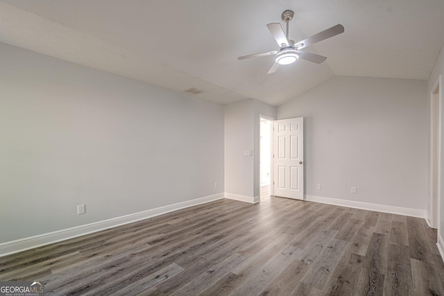 2576 Abbotts Glen Dr NW, Acworth, GA 30101 - spare room with a ceiling fan, dark wood-type flooring, baseboards, and vaulted ceiling