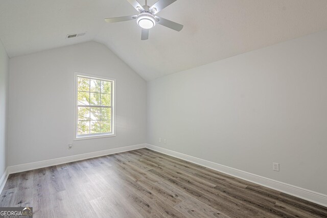 2576 Abbotts Glen Dr NW, Acworth, GA 30101 - bonus room with wood finished floors, ceiling fan, vaulted ceiling, and baseboards