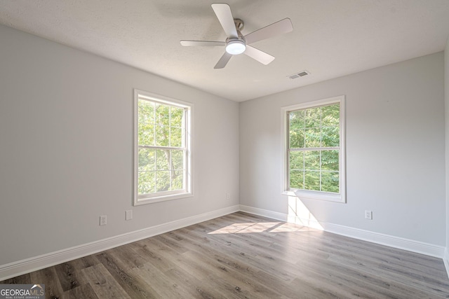 2576 Abbotts Glen Dr NW, Acworth, GA 30101 - empty room featuring wood finished floors, baseboards, and ceiling fan