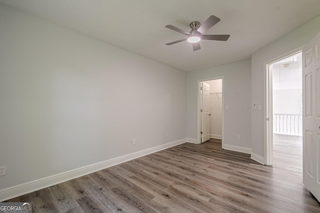 2576 Abbotts Glen Dr NW, Acworth, GA 30101 - spare room with wood finished floors, baseboards, and ceiling fan
