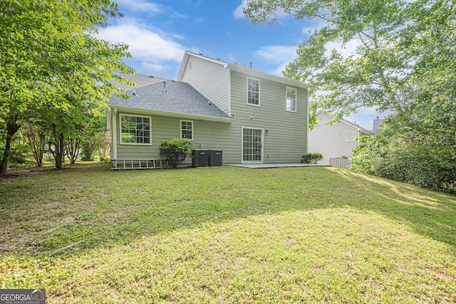 2576 Abbotts Glen Dr NW, Acworth, GA 30101 - rear view of house featuring central AC unit, a yard, and roof with shingles