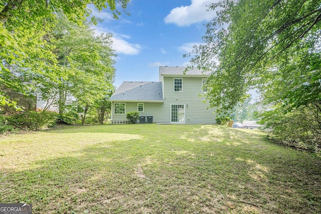2576 Abbotts Glen Dr NW, Acworth, GA 30101 - back of property featuring a yard and a shingled roof