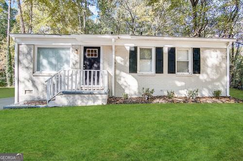 914 Mercury Dr NW, Atlanta, GA 30331 - view of front facade with a front lawn and brick siding