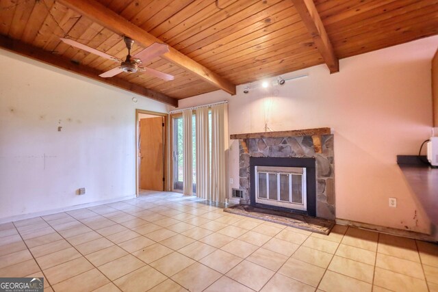 749 Dogwood Dr, Lawrenceville, GA 30046 - unfurnished living room featuring wood ceiling, tile patterned floors, a stone fireplace, and a ceiling fan