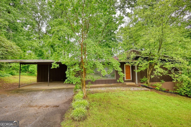 749 Dogwood Dr, Lawrenceville, GA 30046 - view of front of house with a carport, a front lawn, and asphalt driveway
