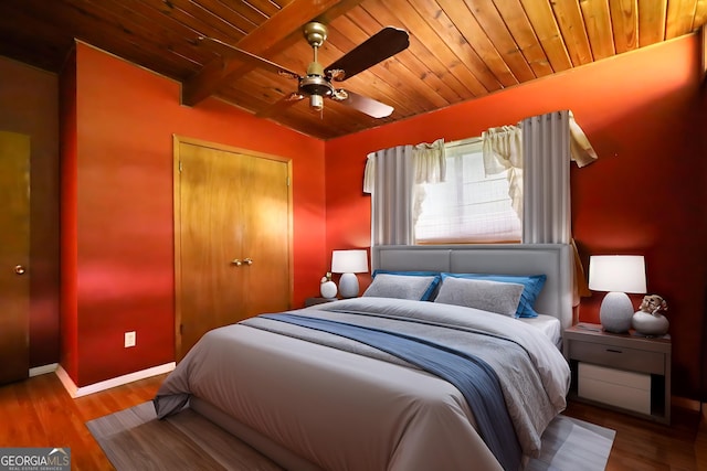 749 Dogwood Dr, Lawrenceville, GA 30046 - bedroom featuring wood ceiling, a closet, baseboards, wood finished floors, and ceiling fan