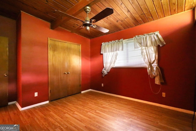 749 Dogwood Dr, Lawrenceville, GA 30046 - unfurnished bedroom with baseboards, wooden ceiling, wood finished floors, a closet, and a ceiling fan