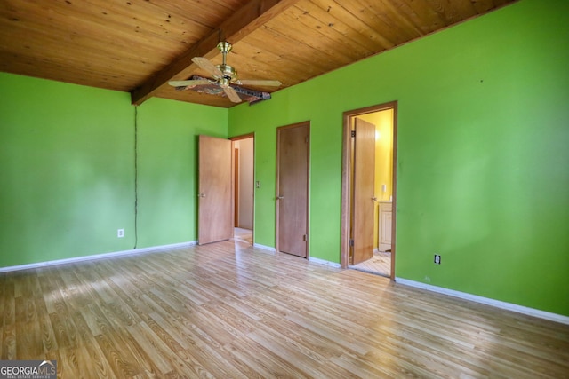 749 Dogwood Dr, Lawrenceville, GA 30046 - unfurnished bedroom featuring baseboards, wood finished floors, wooden ceiling with exposed beams, and ensuite bath