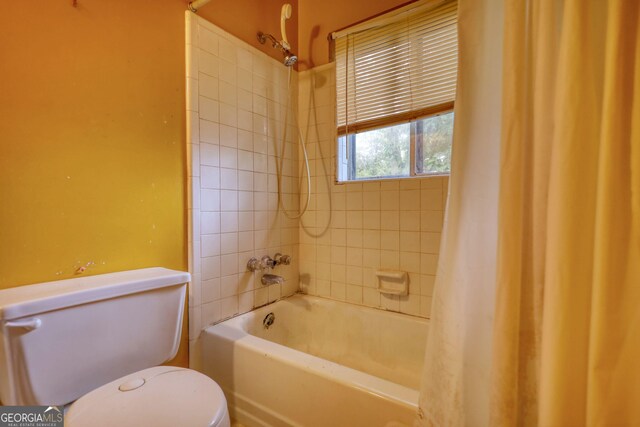 749 Dogwood Dr, Lawrenceville, GA 30046 - bathroom featuring toilet and shower / bath combo with shower curtain