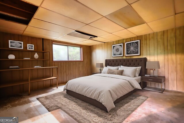 749 Dogwood Dr, Lawrenceville, GA 30046 - bedroom with wood walls and concrete floors