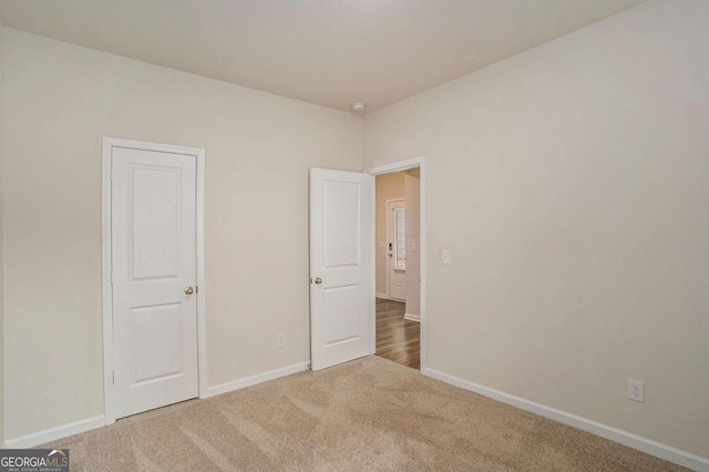 225 Limestone Cir, Conyers, GA 30013 - unfurnished bedroom featuring carpet flooring and baseboards