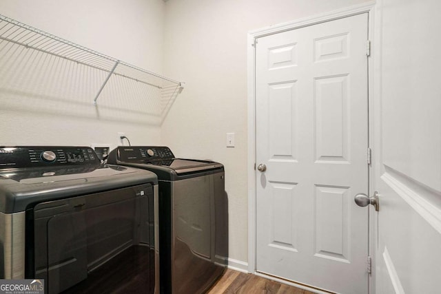 225 Limestone Cir, Conyers, GA 30013 - washroom with washing machine and clothes dryer and wood finished floors
