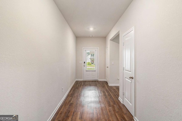 225 Limestone Cir, Conyers, GA 30013 - doorway with dark wood-style floors and baseboards