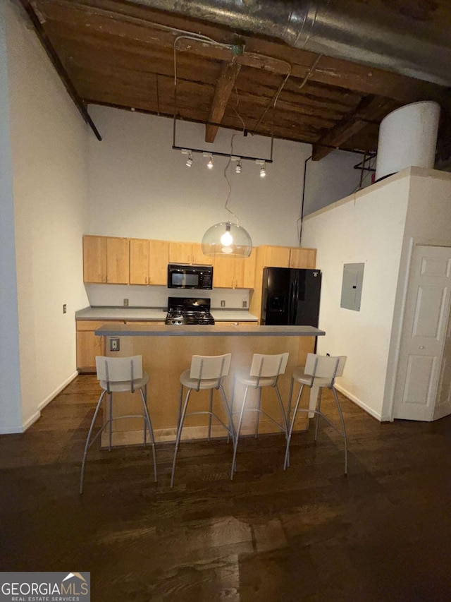 320 Martin Luther King Jr Dr SE Unit 5, Atlanta, GA 30312 - kitchen featuring black appliances, light brown cabinets, a high ceiling, electric panel, and a center island