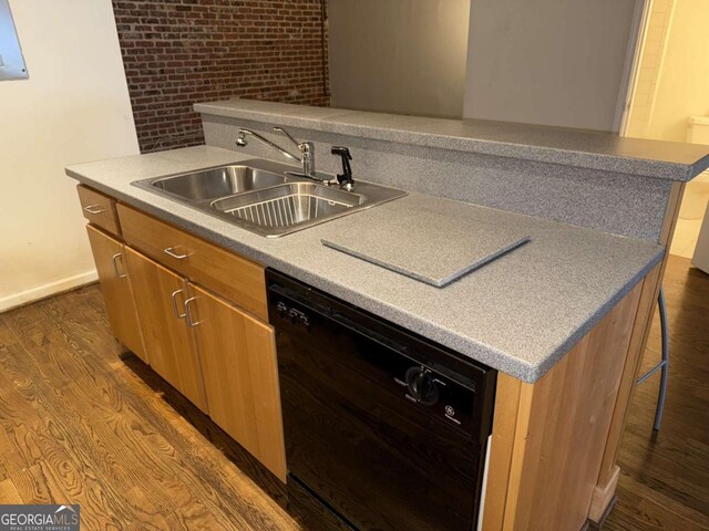 320 Martin Luther King Jr Dr SE Unit 5, Atlanta, GA 30312 - kitchen featuring dishwasher, a sink, dark wood-style flooring, baseboards, and a breakfast bar area