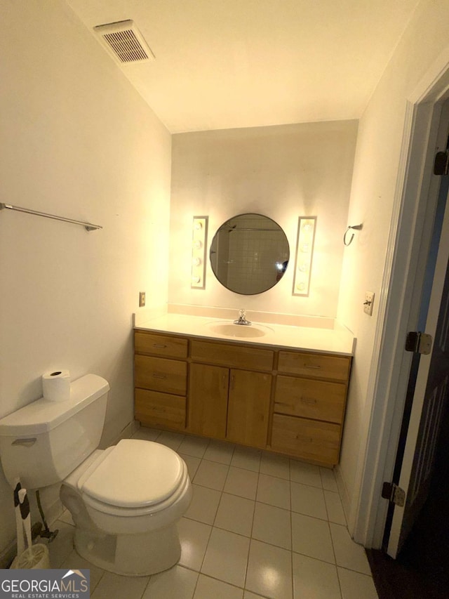 320 Martin Luther King Jr Dr SE Unit 5, Atlanta, GA 30312 - half bath featuring vanity, toilet, and tile patterned flooring