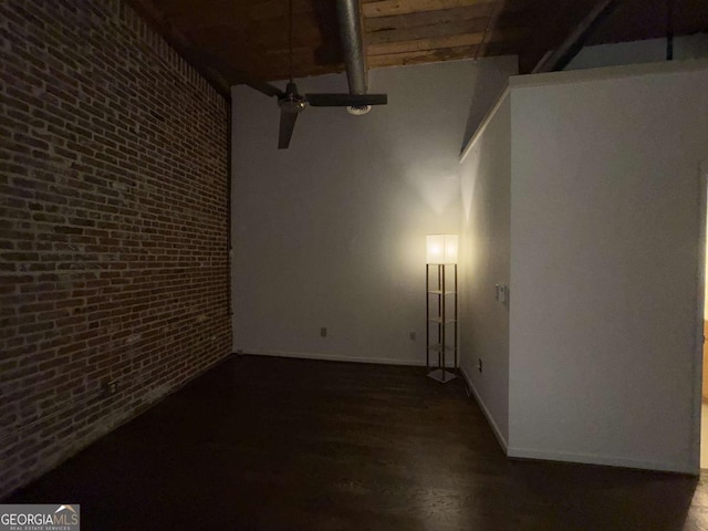 320 Martin Luther King Jr Dr SE Unit 5, Atlanta, GA 30312 - empty room with brick wall, wood finished floors, baseboards, and a towering ceiling