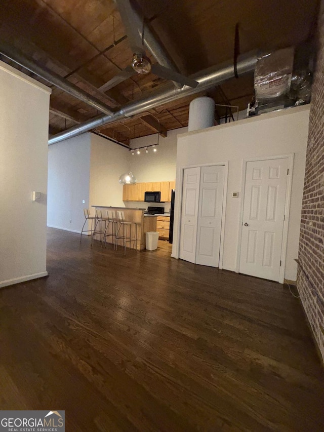 320 Martin Luther King Jr Dr SE Unit 5, Atlanta, GA 30312 - below grade area featuring dark wood-style flooring and brick wall