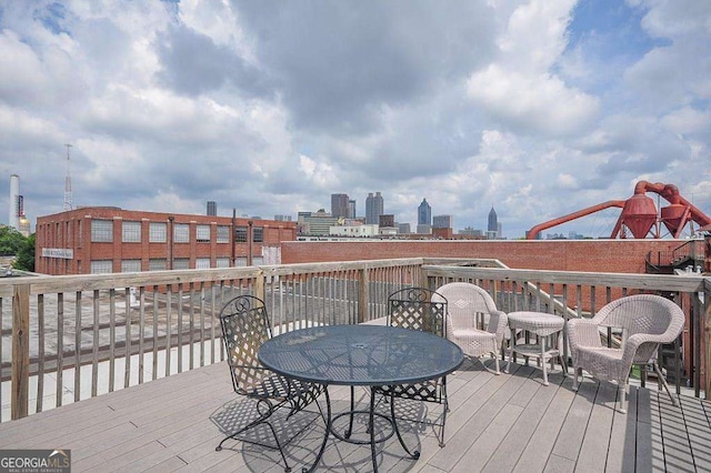 320 Martin Luther King Jr Dr SE Unit 5, Atlanta, GA 30312 - wooden terrace featuring a skyline view and outdoor dining area