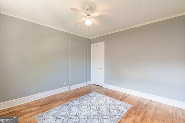 1391 Jefferson Ave, East Point, GA 30344 - spare room featuring baseboards, wood finished floors, a ceiling fan, and ornamental molding