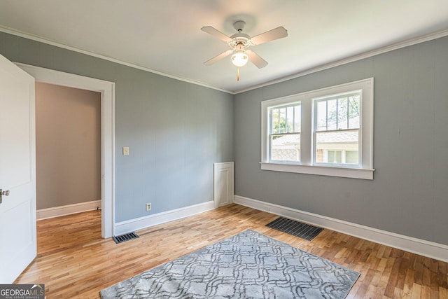 1391 Jefferson Ave, East Point, GA 30344 - empty room with light wood-type flooring, ornamental molding, a ceiling fan, and baseboards