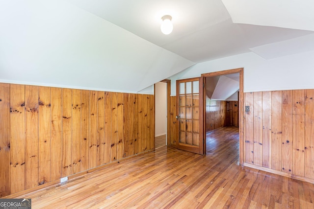 1391 Jefferson Ave, East Point, GA 30344 - additional living space with hardwood / wood-style floors, lofted ceiling, wooden walls, and a wainscoted wall