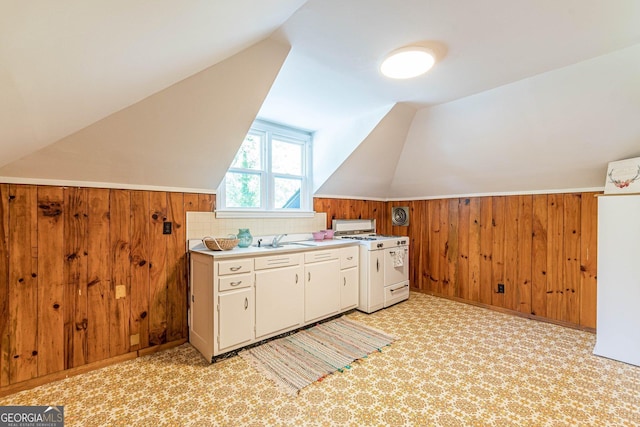 1391 Jefferson Ave, East Point, GA 30344 - additional living space featuring lofted ceiling, wood walls, a sink, and light carpet