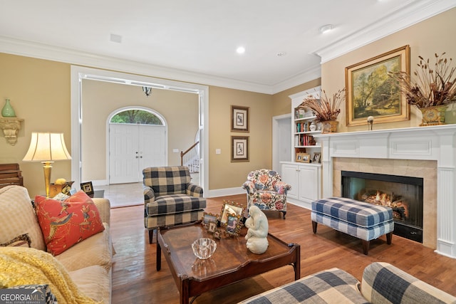100 S Haven Ct, Macon, GA 31210 - living room featuring wood finished floors, stairs, ornamental molding, a tile fireplace, and baseboards
