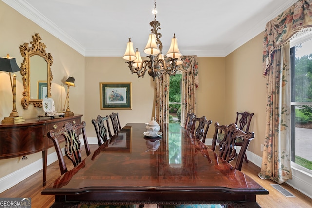100 S Haven Ct, Macon, GA 31210 - dining room featuring a chandelier, plenty of natural light, ornamental molding, wood finished floors, and baseboards