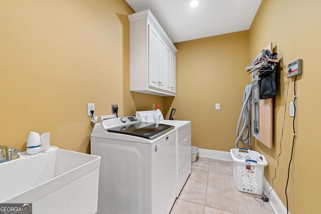 100 S Haven Ct, Macon, GA 31210 - laundry room featuring cabinet space, washer and clothes dryer, baseboards, and light tile patterned flooring