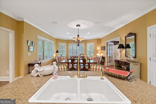 100 S Haven Ct, Macon, GA 31210 - kitchen with open floor plan, a chandelier, ornamental molding, a sink, and recessed lighting