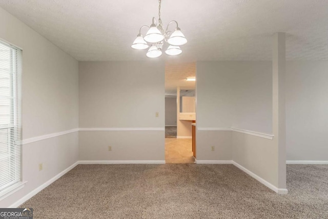 2191 Phillips Rd, Lithonia, GA 30058 - carpeted spare room featuring a chandelier and baseboards