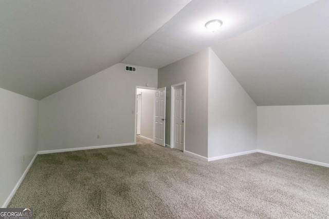 2191 Phillips Rd, Lithonia, GA 30058 - additional living space with carpet floors, lofted ceiling, and baseboards