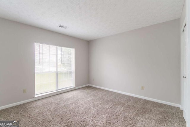2191 Phillips Rd, Lithonia, GA 30058 - carpeted spare room with baseboards and a textured ceiling