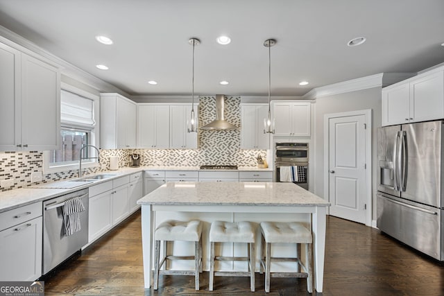 4202 Morrison Way Unit 9, Atlanta, GA 30341 - kitchen featuring appliances with stainless steel finishes, wall chimney range hood, crown molding, a sink, and white cabinetry