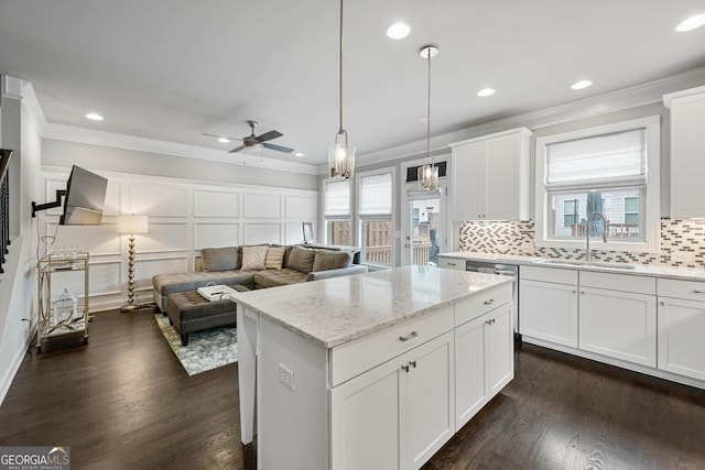 4202 Morrison Way Unit 9, Atlanta, GA 30341 - kitchen with a sink, crown molding, a decorative wall, decorative backsplash, and a kitchen island