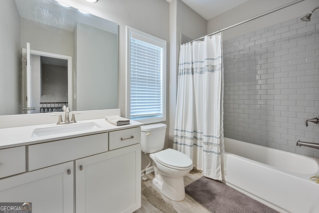 4202 Morrison Way Unit 9, Atlanta, GA 30341 - bathroom featuring toilet, vanity, shower / bath combo with shower curtain, and wood finished floors