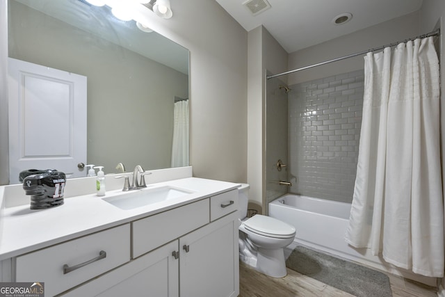 4202 Morrison Way Unit 9, Atlanta, GA 30341 - full bath featuring vanity, wood finished floors, toilet, and shower / bath combo with shower curtain