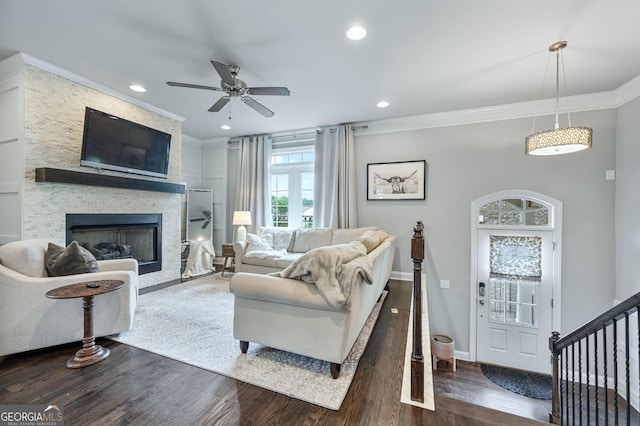 4202 Morrison Way Unit 9, Atlanta, GA 30341 - living room featuring ornamental molding, a ceiling fan, dark wood-style floors, a large fireplace, and baseboards