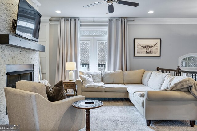 4202 Morrison Way Unit 9, Atlanta, GA 30341 - living area featuring a ceiling fan, ornamental molding, a stone fireplace, and recessed lighting